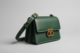 Sculpted Designer Shoulder Bag in Forest Green, side angle view