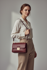 Female model carrying Contemporary Flap Shoulder Bag in Deep Burgundy