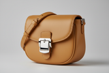 Curved Mini Shoulder Bag in Warm Sandstone, silver hardware and leather close-up