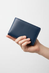 Hand holding Executive Compact Wallet in Blue
