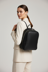 Female model wearing Contemporary City Backpack in Obsidian Pearl Black