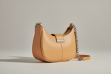 Curved Mini Shoulder Bag in Warm Sandstone, side angle view