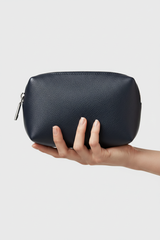 Hand holding Modern Travel Pouch in Navy and Silver