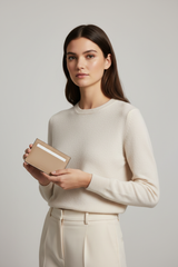 Female model holding Luxury Essential Card Holder in Dune Silkstone Beige