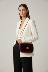 Contemporary Mini Flap Bag in Velvet Noir Burgundy – Female Model