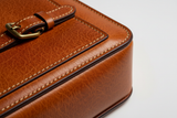 Modern Travel Pouch in Orange and Brown, saddle leather and hardware macro close-up