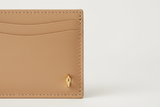 Luxury Essential Card Holder in Dune Silkstone Beige, smooth leather and hardware close-up