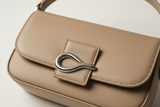 Soft Curve Shoulder Bag in Soft Beige, leather and silver hardware close-up