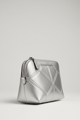 Minimal Luxe Pouch in Geometric and Silver, portrait side angle view