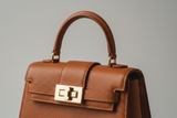 Mini Luxe Top-Handle Bag in Cinnamon Brown, gold hardware and leather close-up