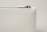 Minimal Luxury Pouch in White, leather and zipper macro close-up