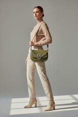 Female model carrying Soft Curve Shoulder Bag in Olive Green
