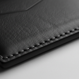 Night Ember Carbon — Leather Stitching Macro