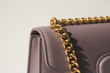 Elegant Chain Shoulder Bag in Dusty Lavender, gold chain and leather close-up