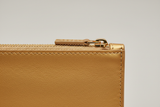 Minimal Luxury Pouch in Gold, leather and zipper macro close-up