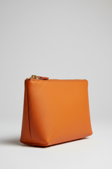 Minimal Luxe Pouch in Orange and Gold, portrait side angle view