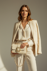 Female model carrying Soft Vintage Shoulder Bag in Cream Ivory
