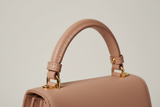 Luxury Mini Shoulder Bag in Rose Beige, top handle and hardware close-up