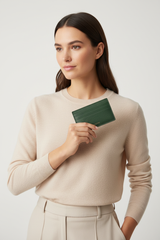 Female model holding Luxury Essential Card Holder in Evergreen Timber Moss