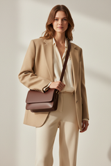 Female model carrying Soft Matte Shoulder Bag in Deep Walnut