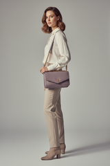 Female model carrying Elegant Chain Shoulder Bag in Dusty Lavender