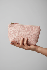 Hand holding Signature Utility Pouch in Floral and Pink