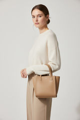 Scandinavian Mini Tote in Sandstone Drift Beige – Female Model
