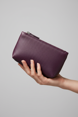 Hand holding Premium Leather Utility Pouch in Purple