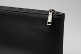 Minimal Luxury Pouch in Black, leather and zipper macro close-up