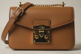 Classic City Shoulder Bag in Camel Tan, front-lock closure and hardware close-up