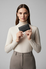 Female model holding Luxury Essential Card Holder in Velvet Phantom Noir
