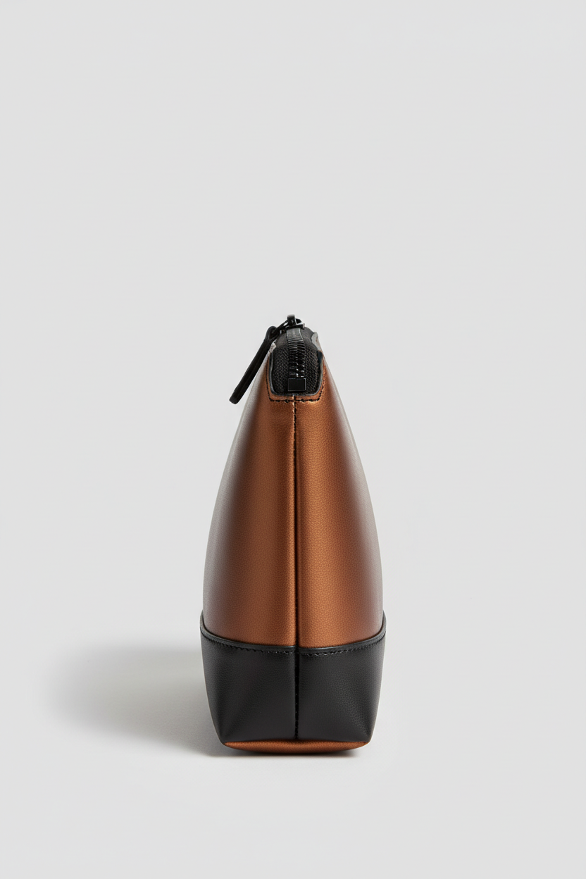 Minimal Luxe Pouch in Bronze and Black, portrait side angle view