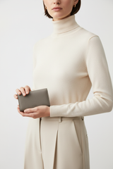 Female model holding Luxury Essential Card Holder in Frozen Atlantic Grey