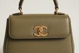 Mini Luxe Top-Handle Bag in Dusty Olive, gold hardware and leather close-up
