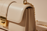 Sculpted Designer Shoulder Bag in Cream Beige, sculpted leather and hardware close-up