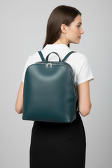 Female model wearing Contemporary City Backpack in Deep Harbor Teal