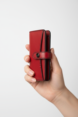 Hand holding Urban Everyday Wallet in Red and Black
