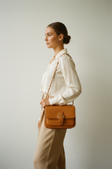 Female model carrying Soft Vintage Shoulder Bag in Warm Caramel