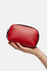 Hand holding Modern Travel Pouch in Red and Black